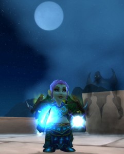 Tellisa, the pink-haired gnome Priest, and her ghostly companion standing on top of the walls of Stormwind